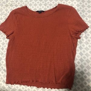 American eagle, Size medium, pumpkin coloured tee.